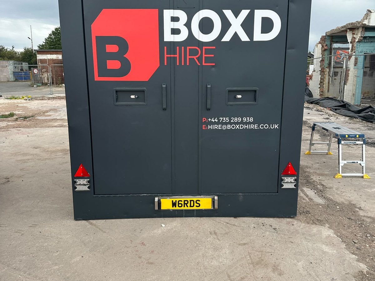 Rear doors of the BOXD 12ft welfare unit with BOXD Hire livery and contact details
