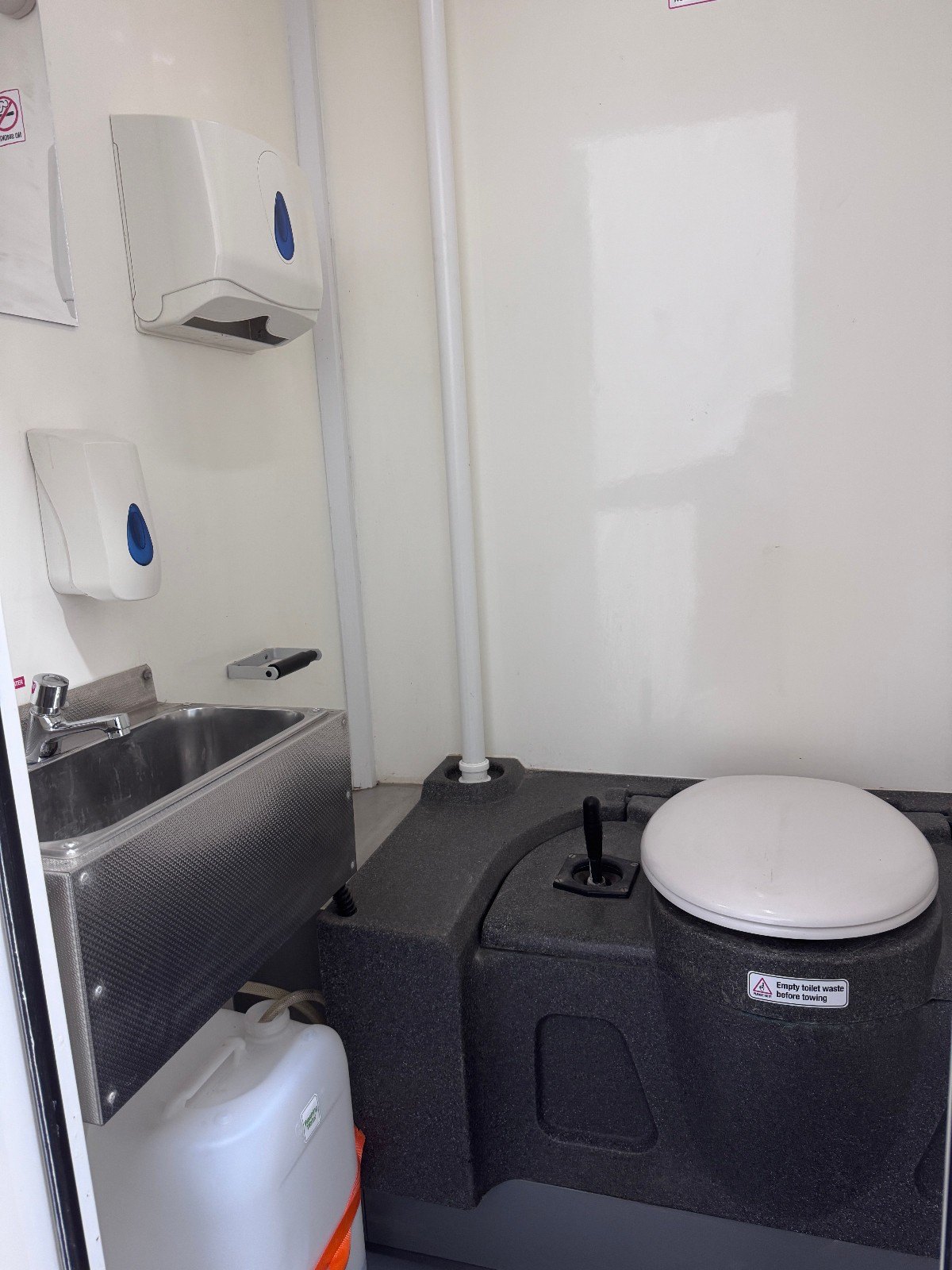 WC inside the BOXD 12ft welfare unit with chemical toilet and stainless hand wash basin