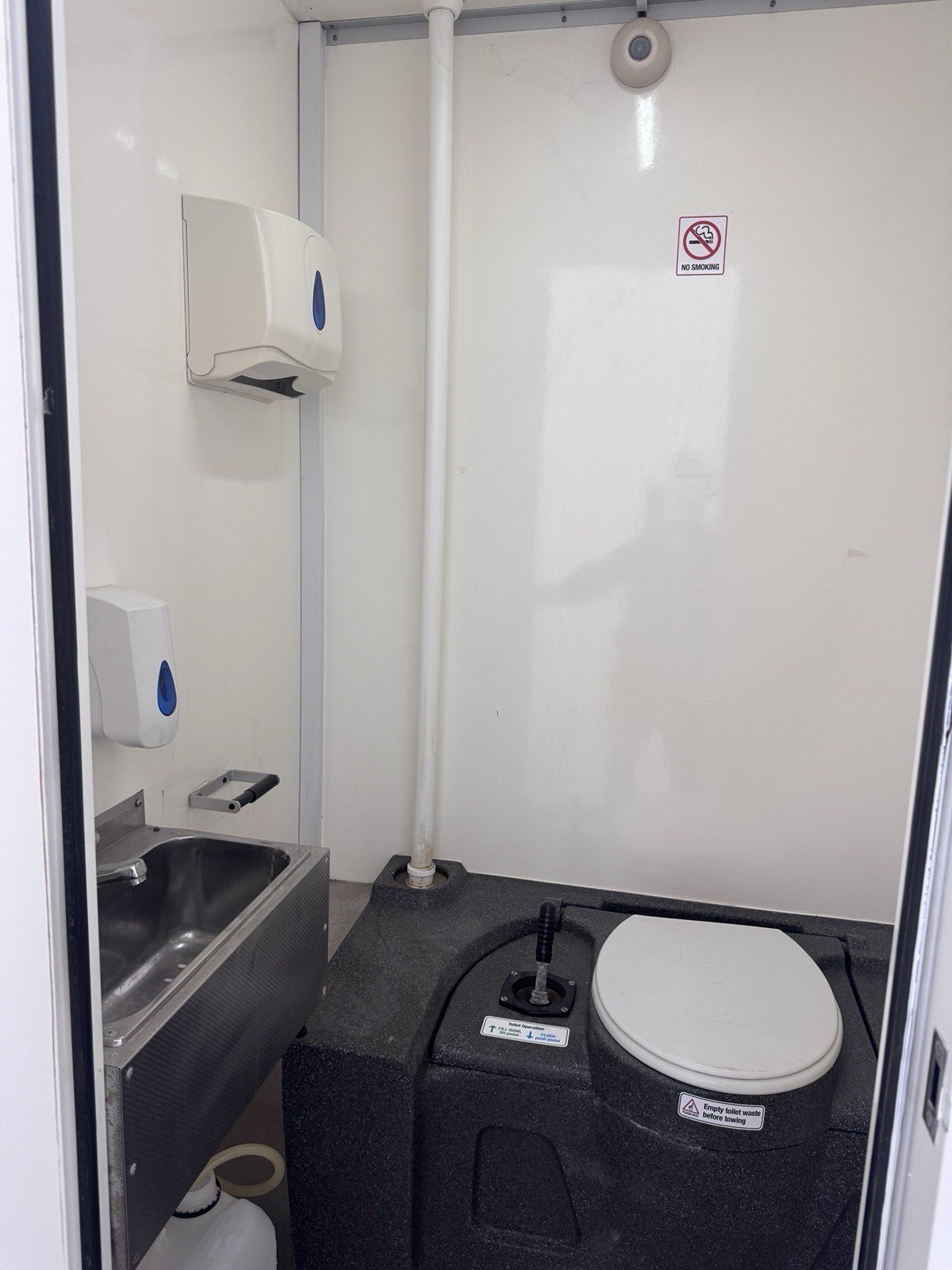 WC inside the BOXD 16ft welfare unit with chemical toilet and stainless hand wash basin