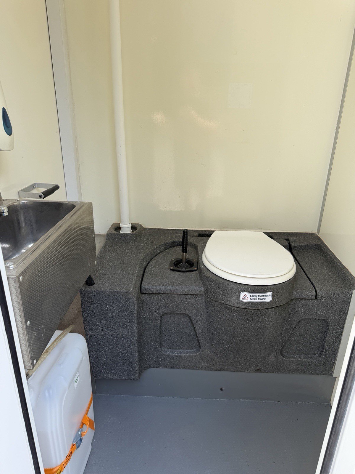 WC inside the BOXD 20ft welfare unit with chemical toilet and hand wash basin